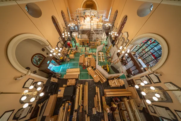 Overhead view of the nave of St James' Church filled with organ components and scaffolding during installation